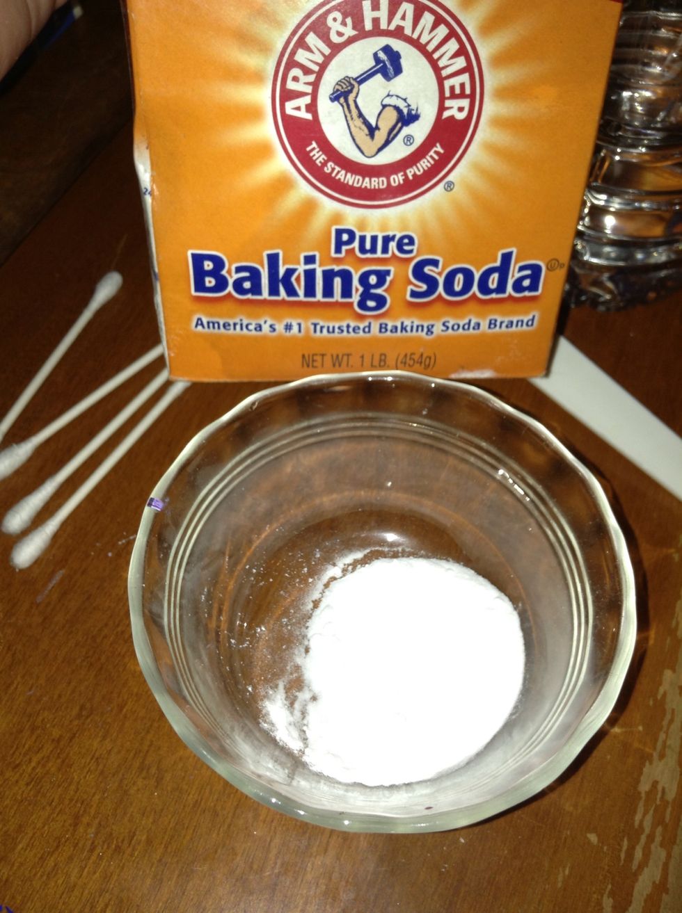 Put about 1/2 a tablespoon of baking soda into a little bowl.