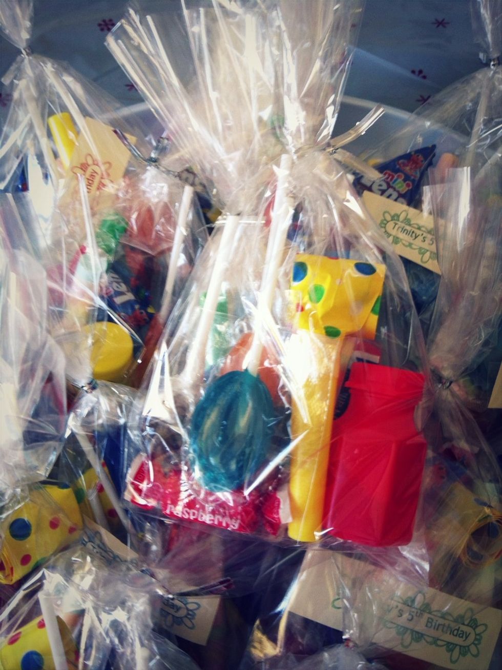 Put all items in bag & twist tie to secure. I also made little labels for each loot bag, using standard label templates, using red, green and blue ink, cut to size from A4 colour paper.