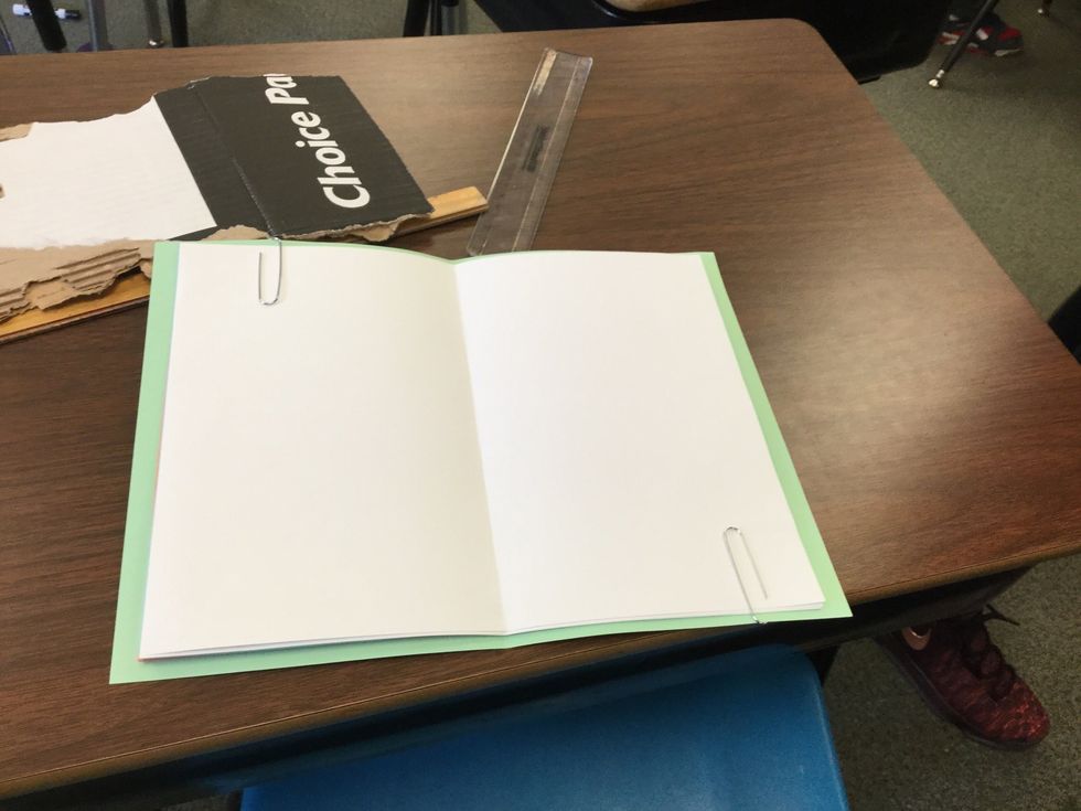 Put all ten papers in the cover like any book