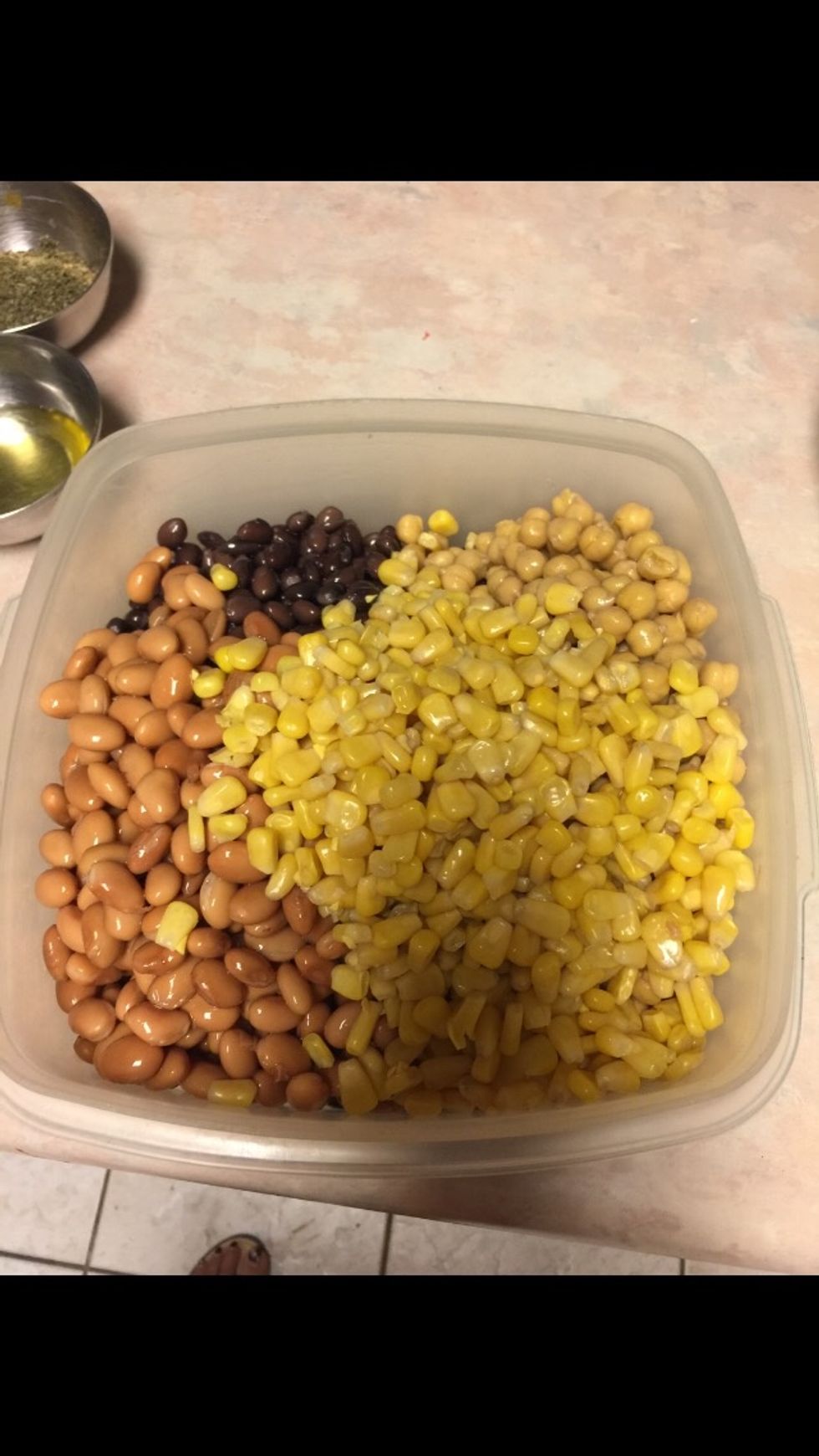 Put all the beans and chick peas in a bowl i after rinsing in a colander