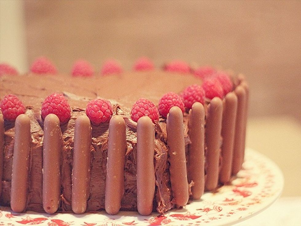 Put all the cake ingredients except the melted chocolate into a bowl and beat together with an electric whisk until creamy, then fold in the melted chocolate. Add more milk if the mixture is stiff.
