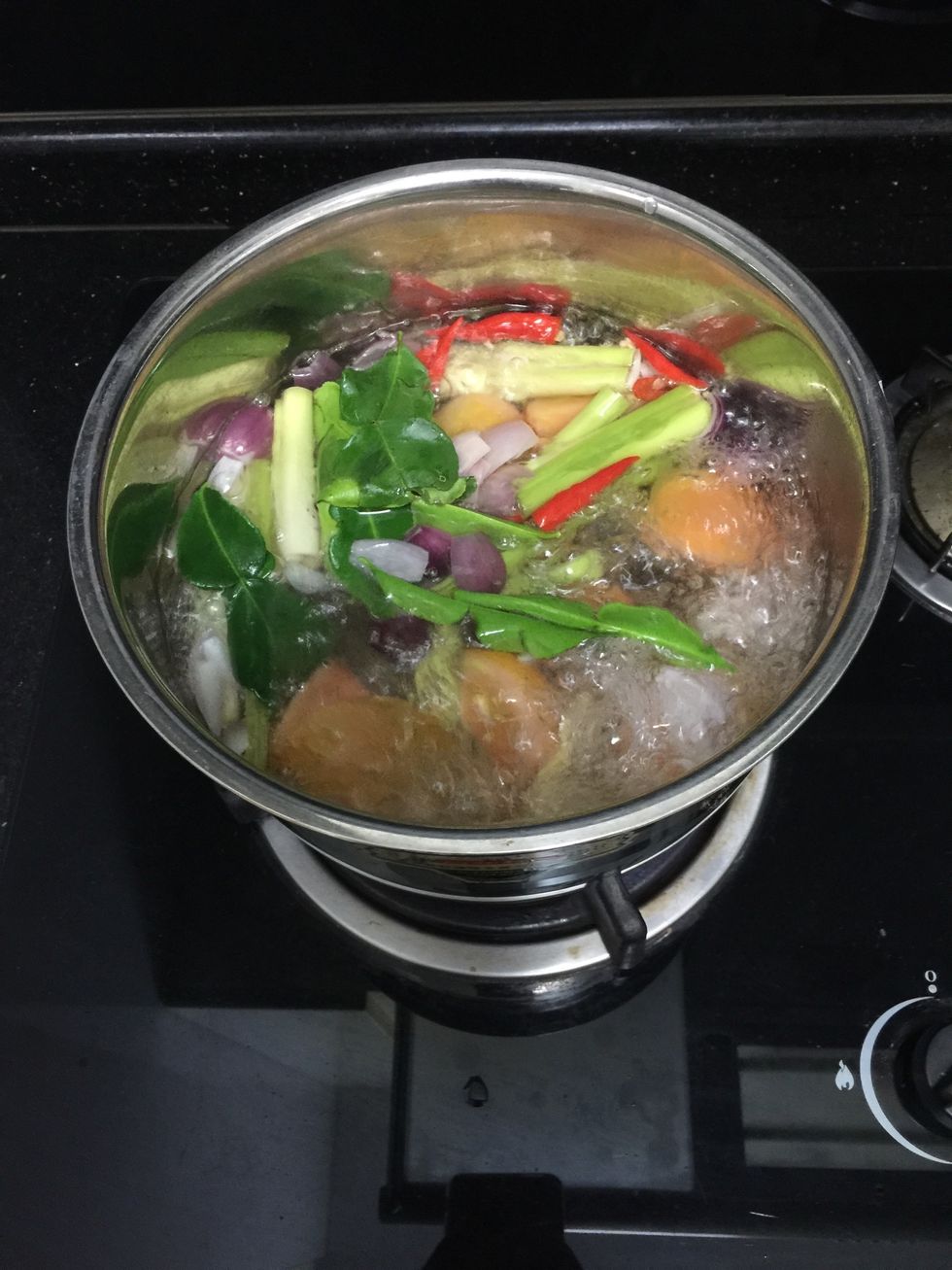 Put all the cut ingredients into the boiling water and cook for 15 minutes in medium heat.