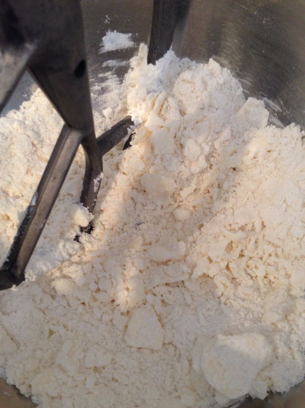 Put all the dry ingredients in the bowl of your mixer. That's 6oz flour, 3 1/4 oz sugar for you weighing types. Blend it briefly then add the butter