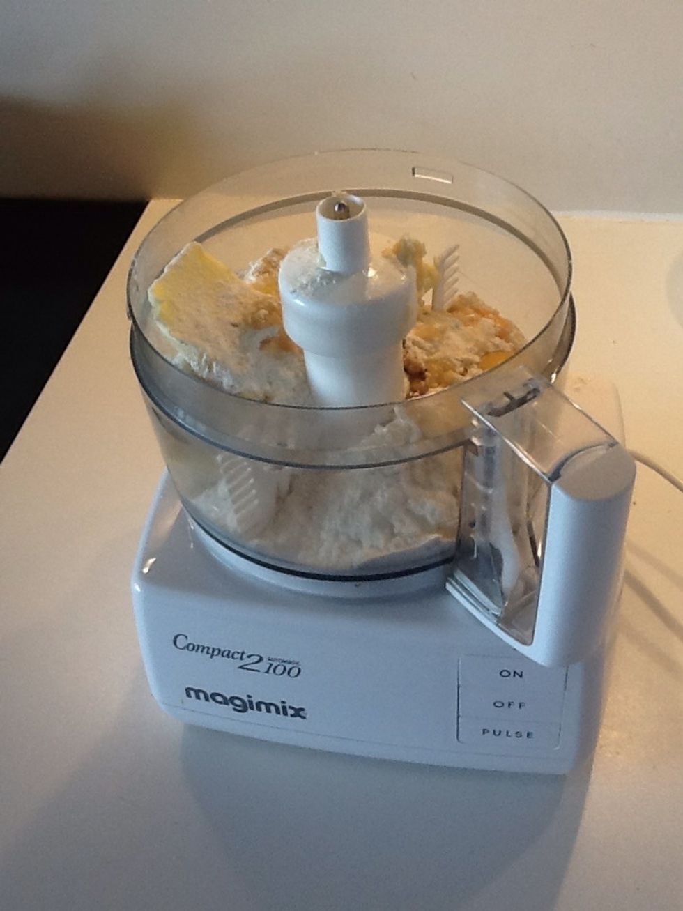 Put all the ingredients for the buns, except the milk, into a food processor and blitz until smooth.