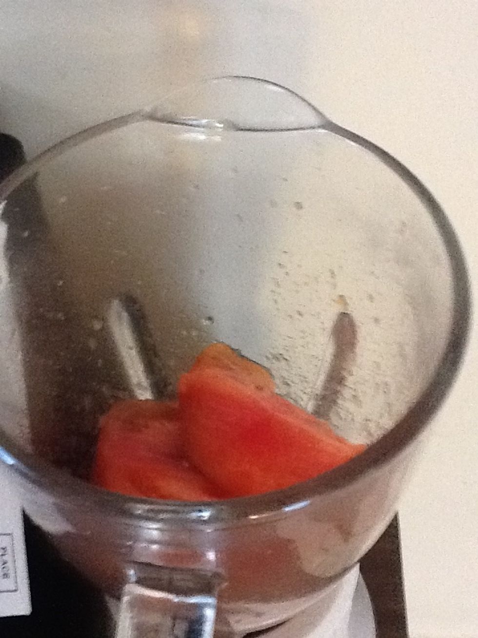 Put all tomatoes and minced ginger in the grinder