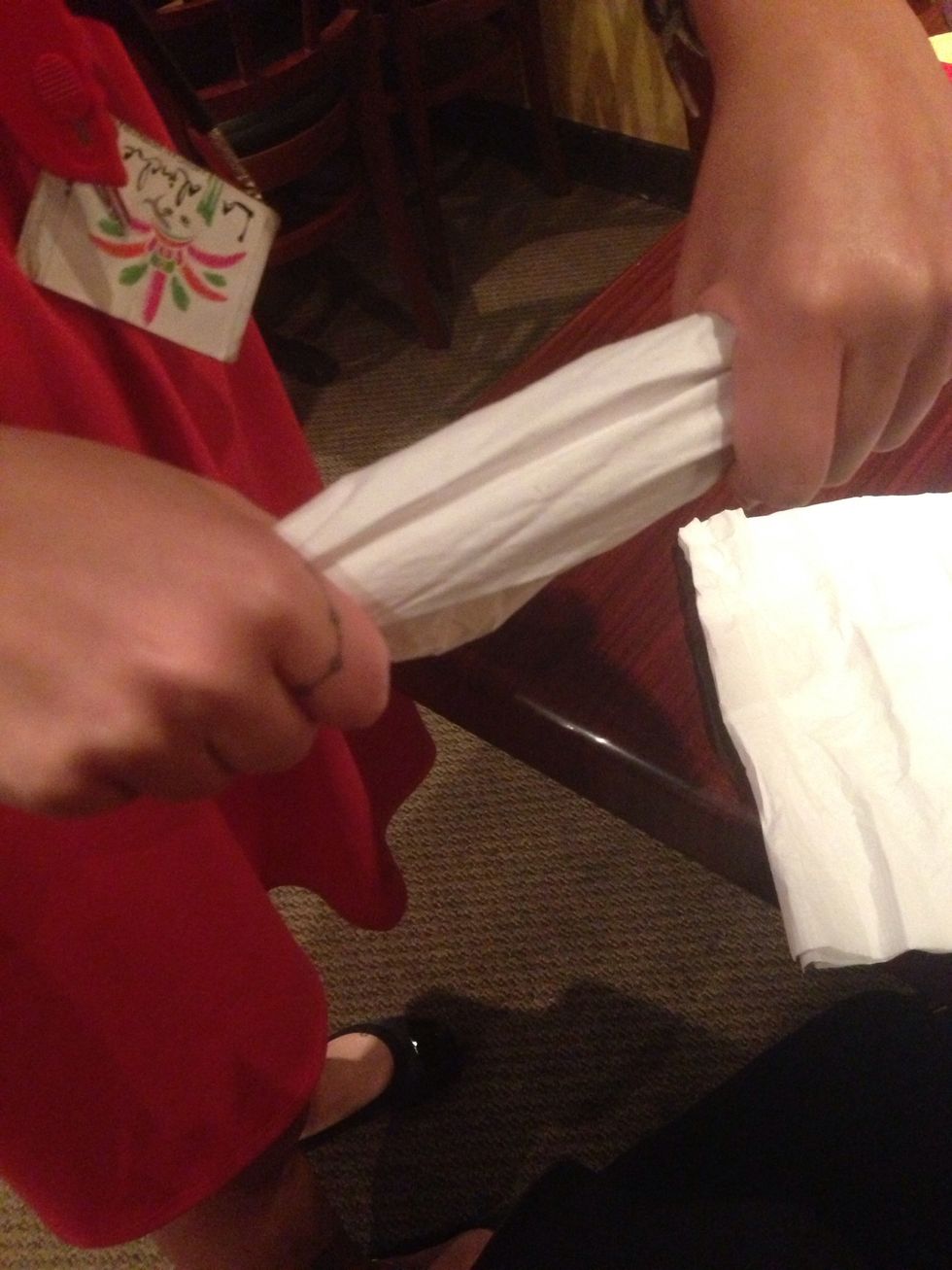 Put all your napkins together and crunch them length wise like so.