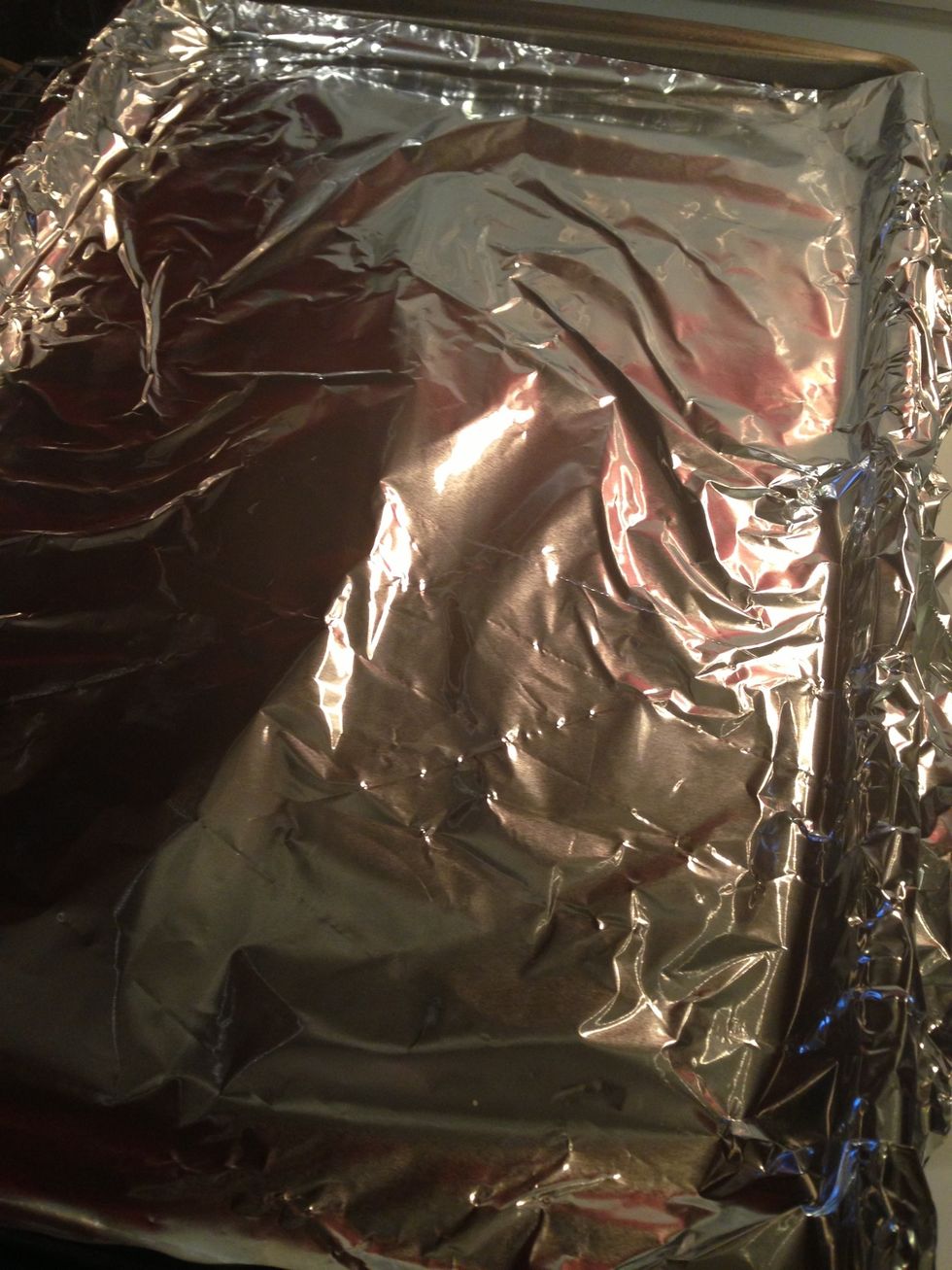 Put aluminum foil onto cookie sheet.