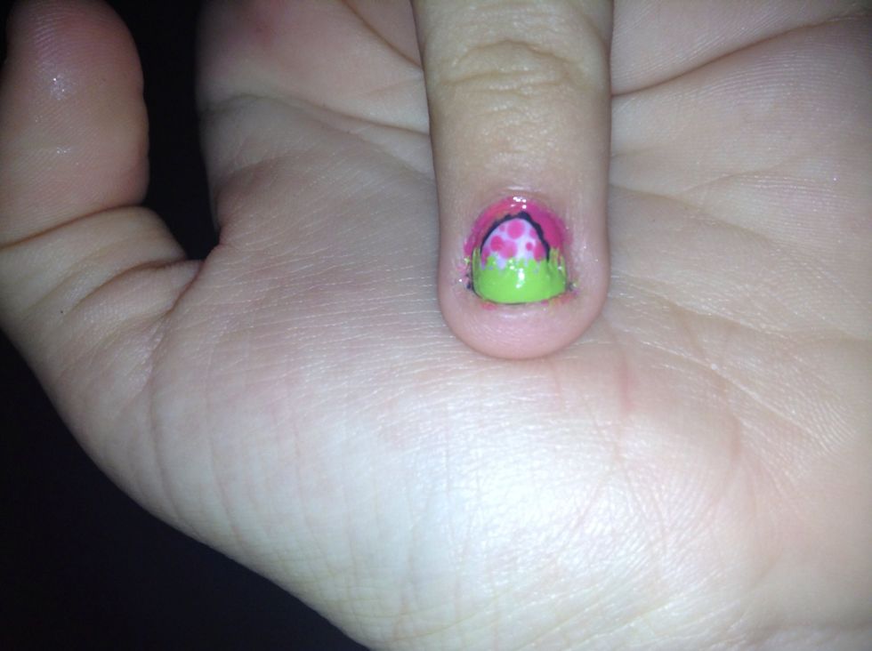 Put an oval in the lower middle and outline with a black if you want then make a green French tip then with a pin drag the "top" with the pointy part of the pin then add dots on the egg