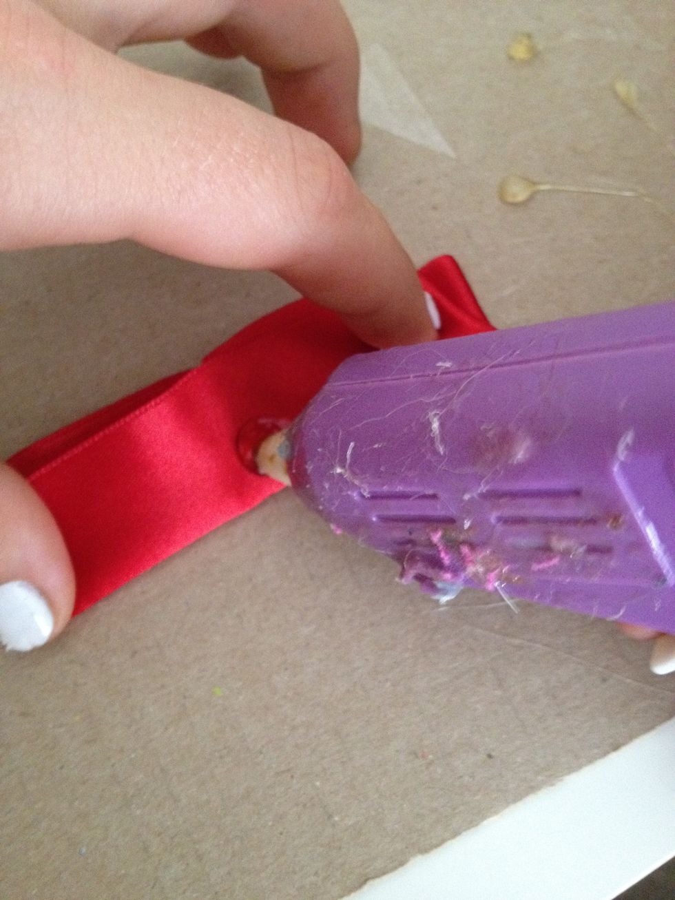 put another dab of glue on the folded bit in the center and fold on flap down