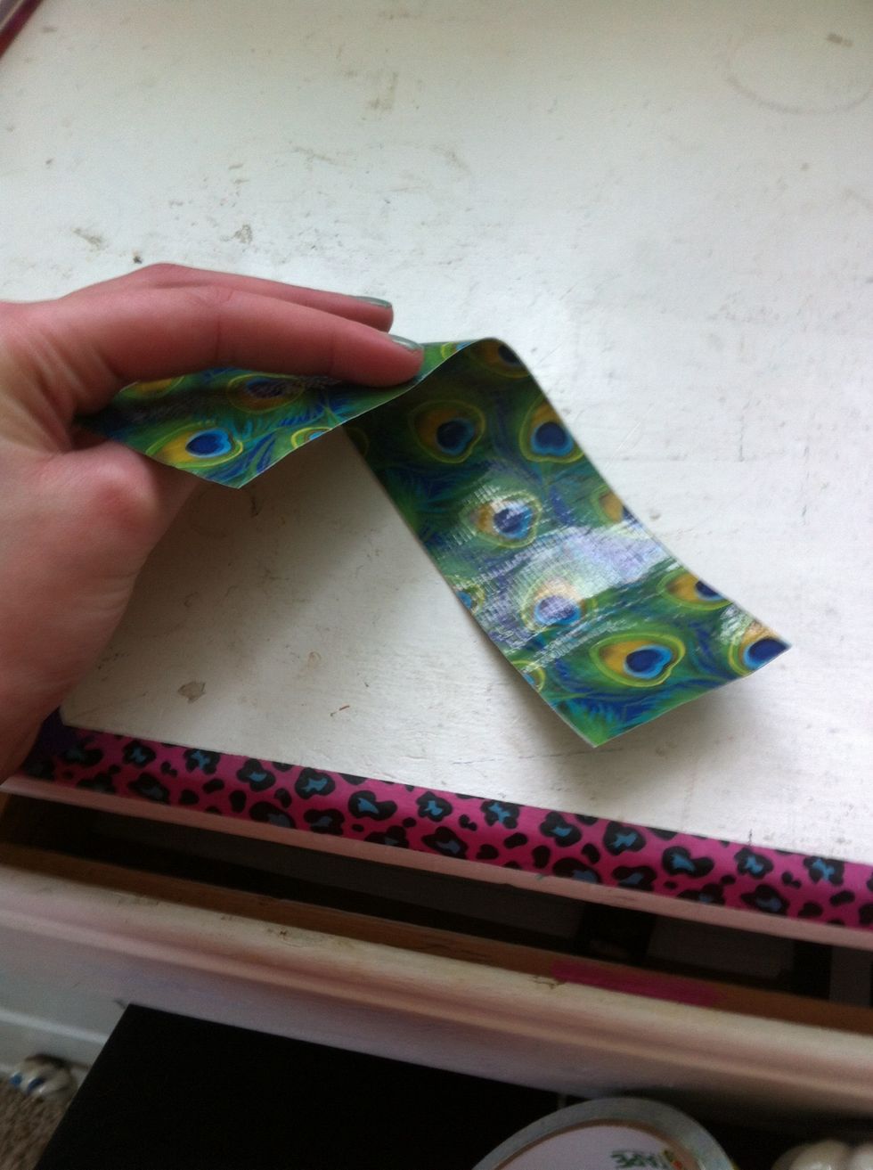 Put another one same size on top then you have a double sided strip of duct tape