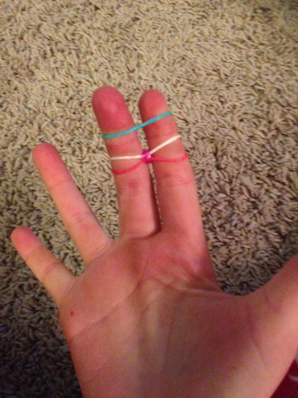 Put another rubber band not in an 8 in top of the other 3