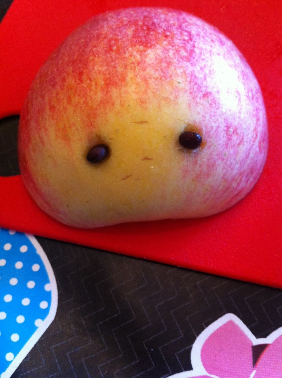 Put apple stone in each eye