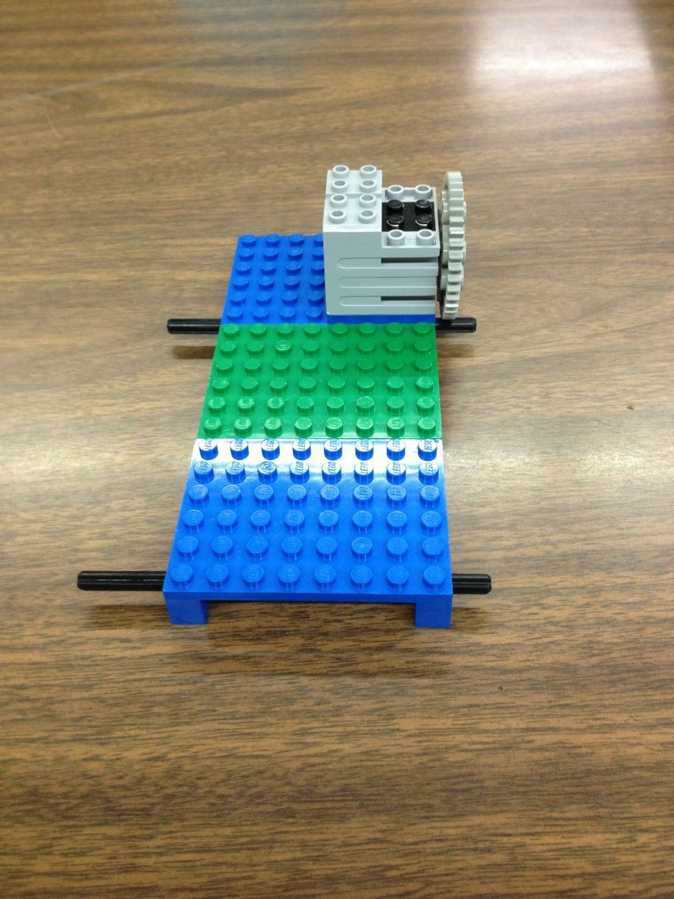 Put axle through front beam and fifth from the back holes.