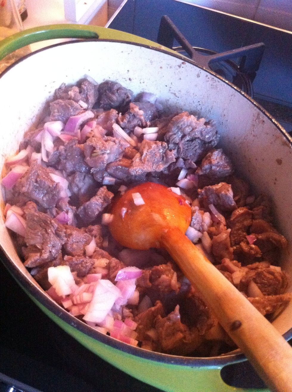 Put back beef in to casserole and add onions, keep sauteeing...