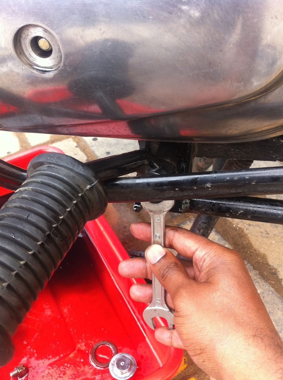 Put back foot peg and tighten the nut using 14mm spanner