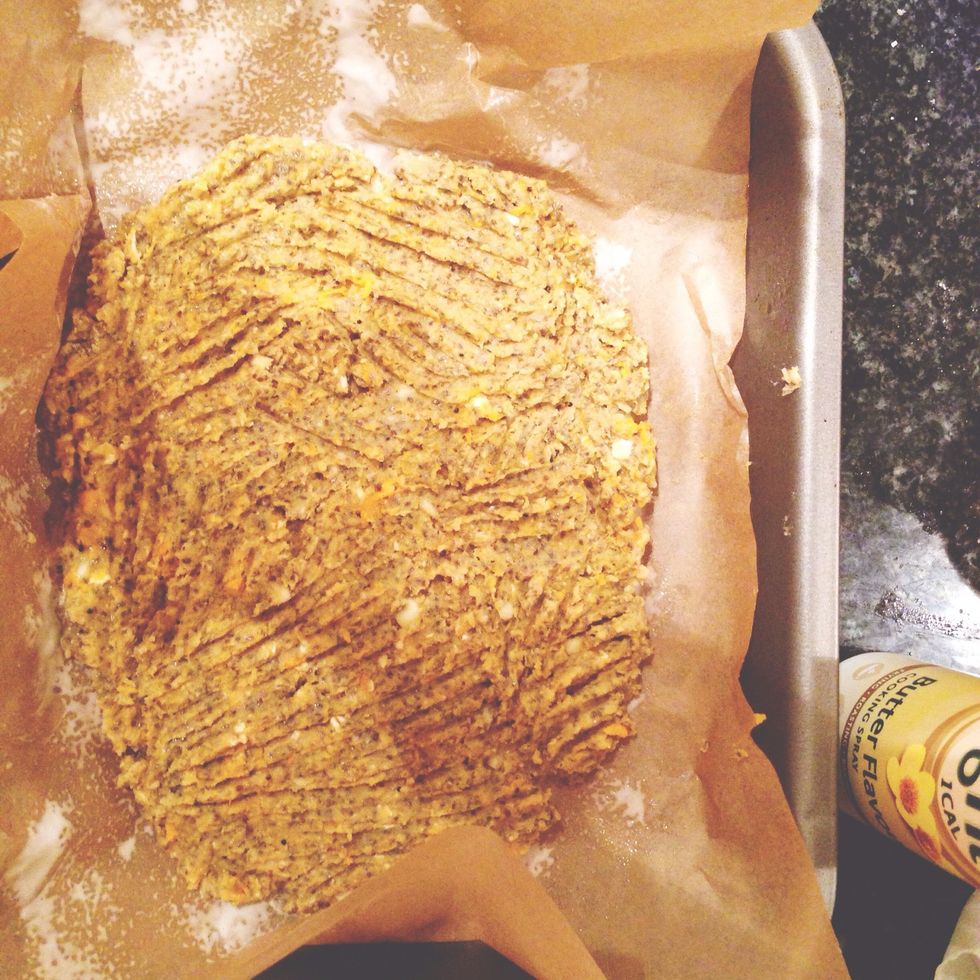 Put baking paper in an ovenproof tray with fry light and shape the "dough" into a round pizza. Put it in the oven for 10 mins or until golden, take out and flip to heat on the other side until golden