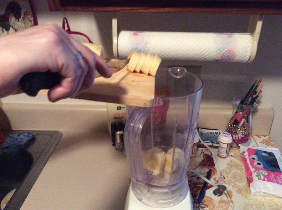 Put banana slices into blender