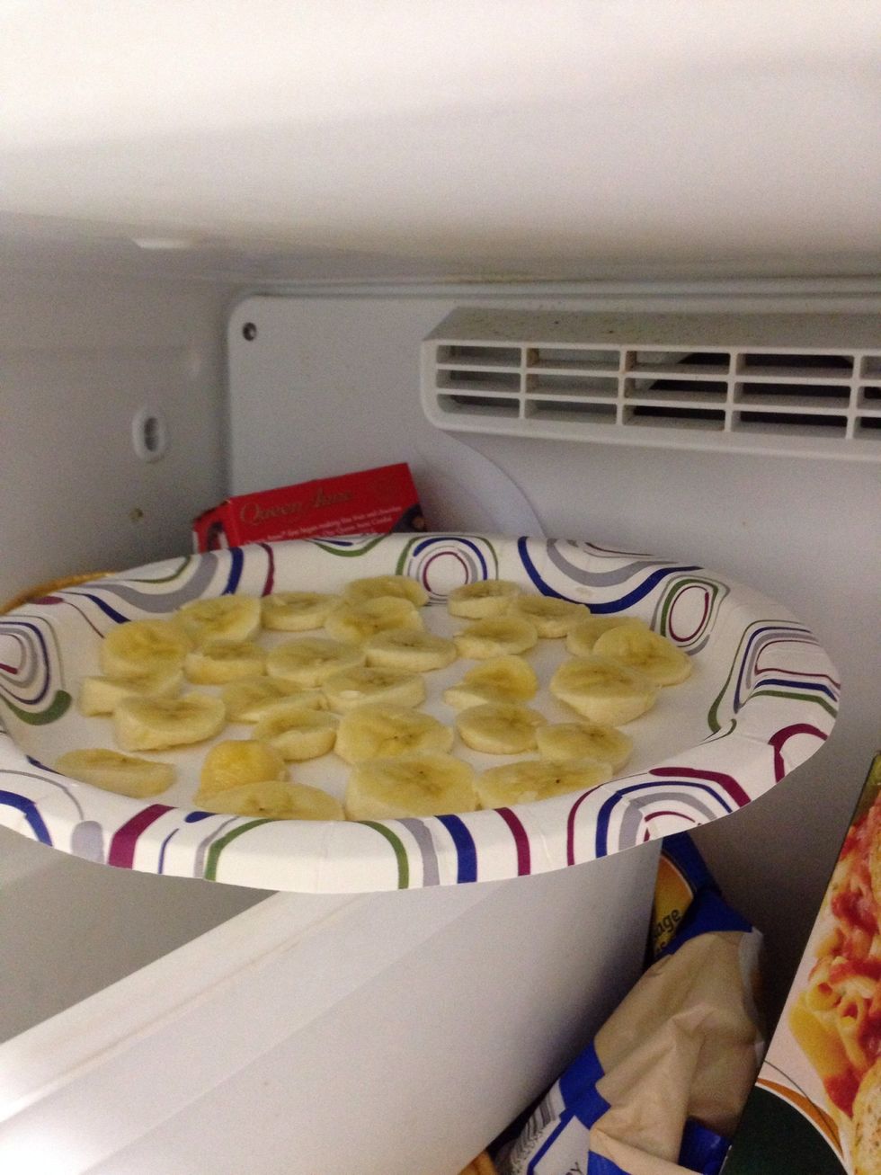 Put bananas in freezer and wait for them to freeze. 1 hour for really thin slices but 3-4 is perfect.