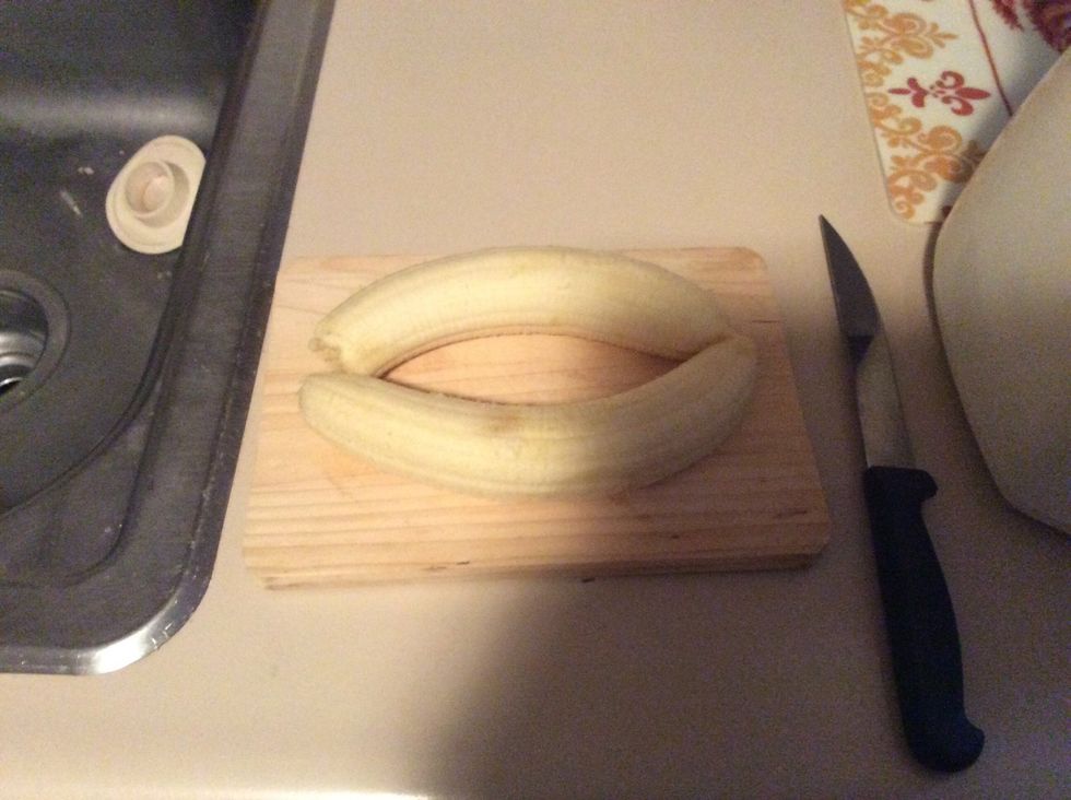 Put bananas on cutting board and grab knife