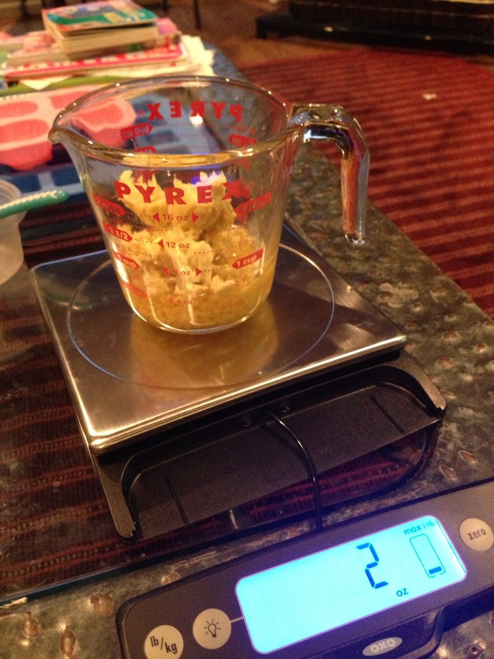 Put bee wax and Shea butter in measuring cup. Place the cup on scale. Zero out the scale. Add avocado oil in it.