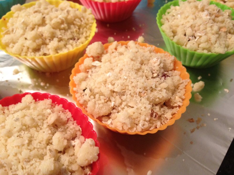 Put berries into the cake form and sprinkle the crumbs over them like in the photo.