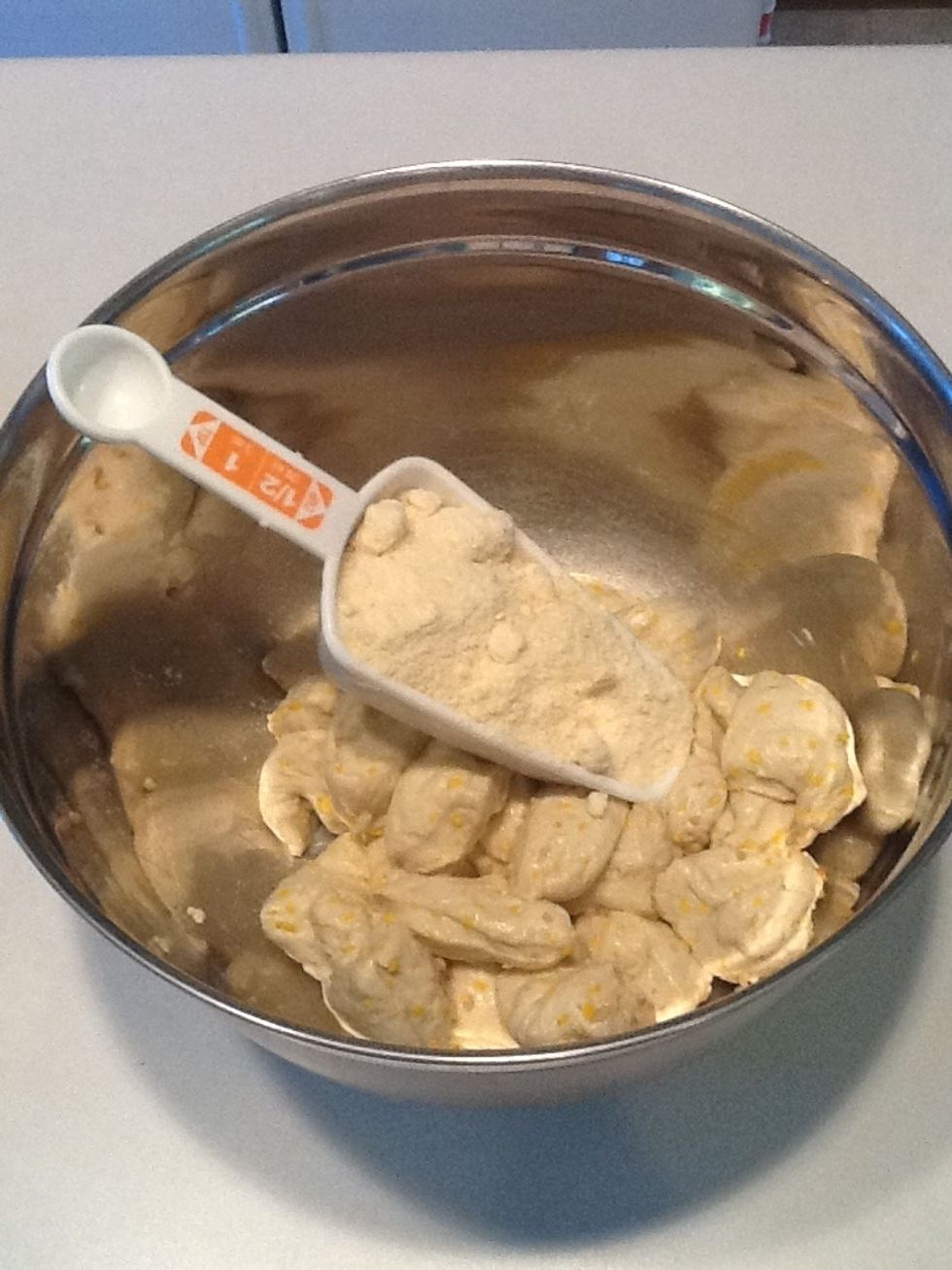 Put biscuit pieces in a bowl. Add garlic and Parmesan cheese.