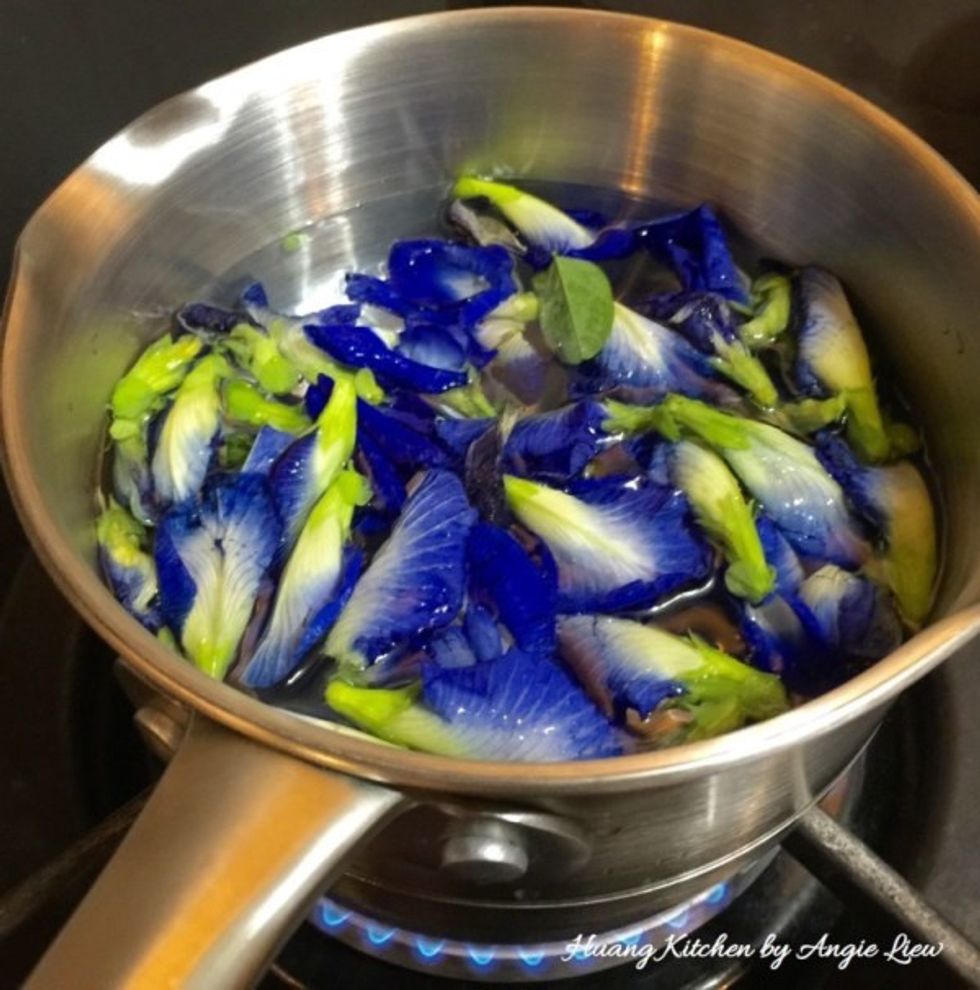 Put blue pea flowers and water into a pot and boil till the water turns blue. Leave the blue coloured water to cool and strained.