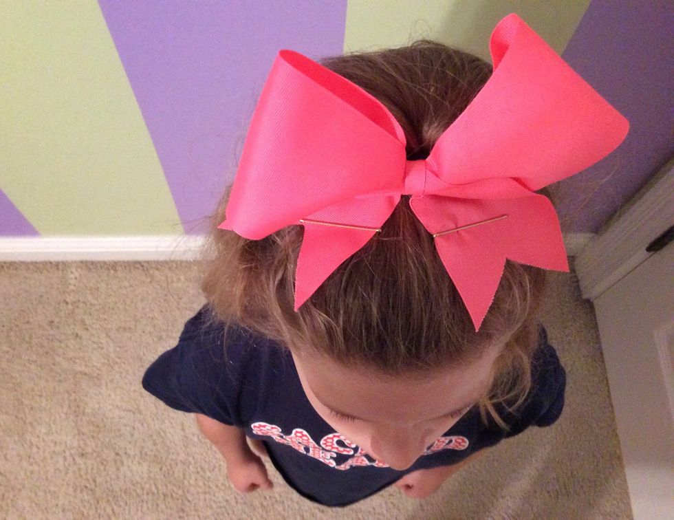 Put bobby pins on the flaps of your bow so it stays in place.