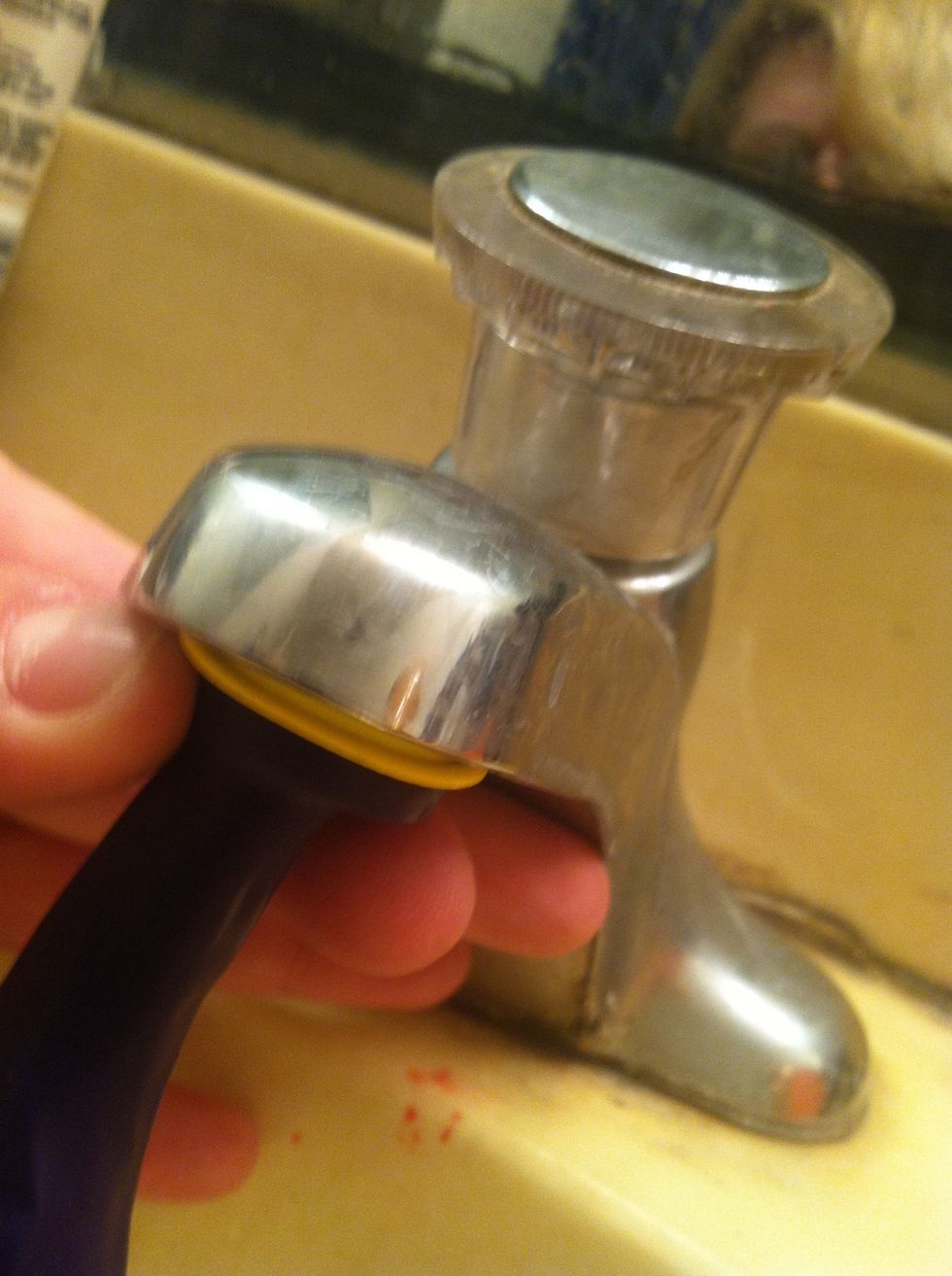 Put both nozzles over the water spigot as if they were one