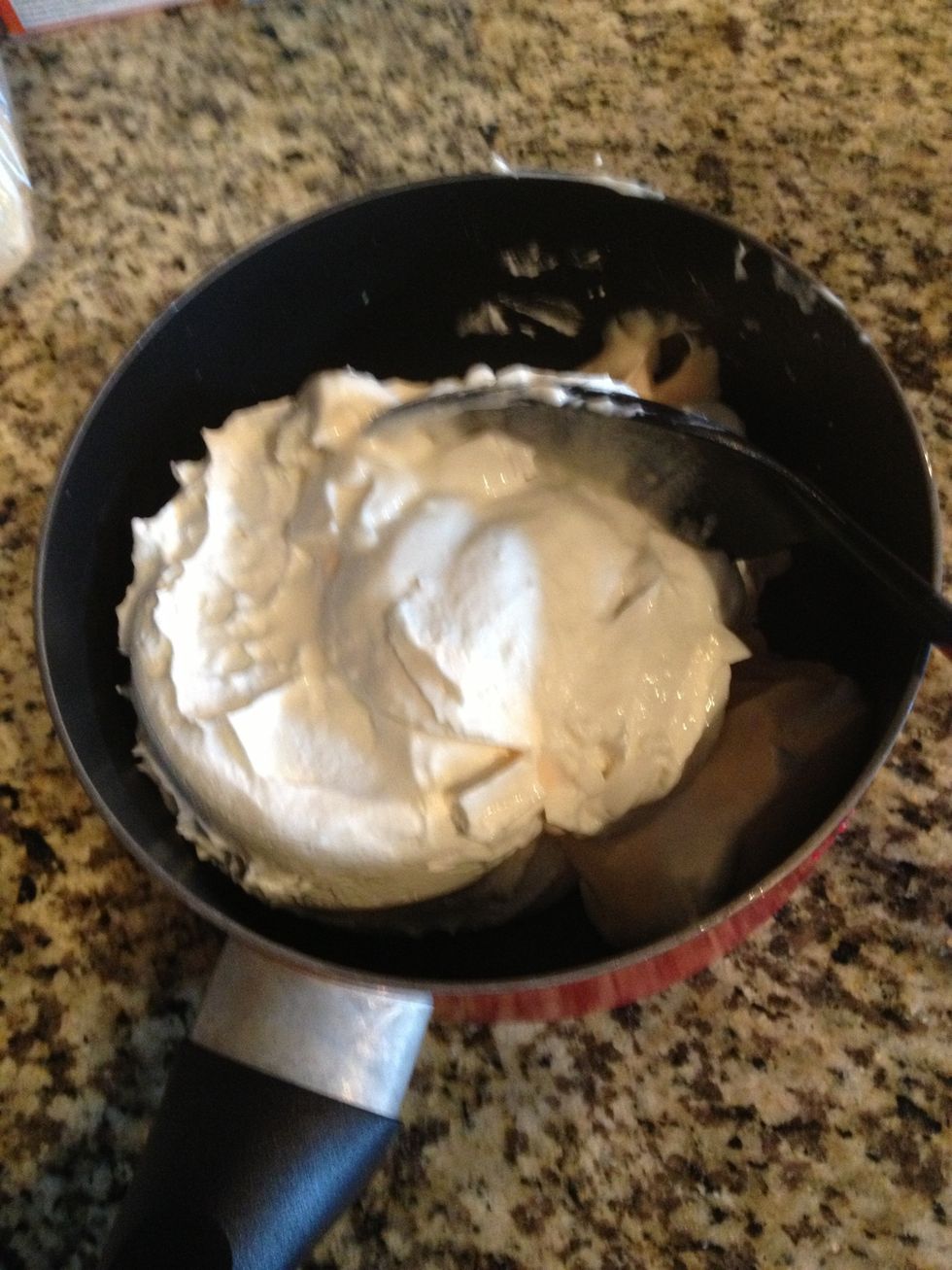 Put both yogurts and cool whip into a bowl and mix!