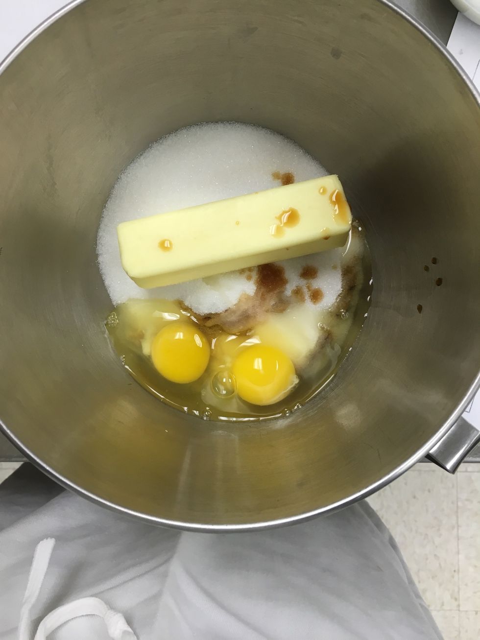 Put butter, sugar, brown sugar, eggs, and vanilla into a standard mixer bowl and cream with the flat beater bar.