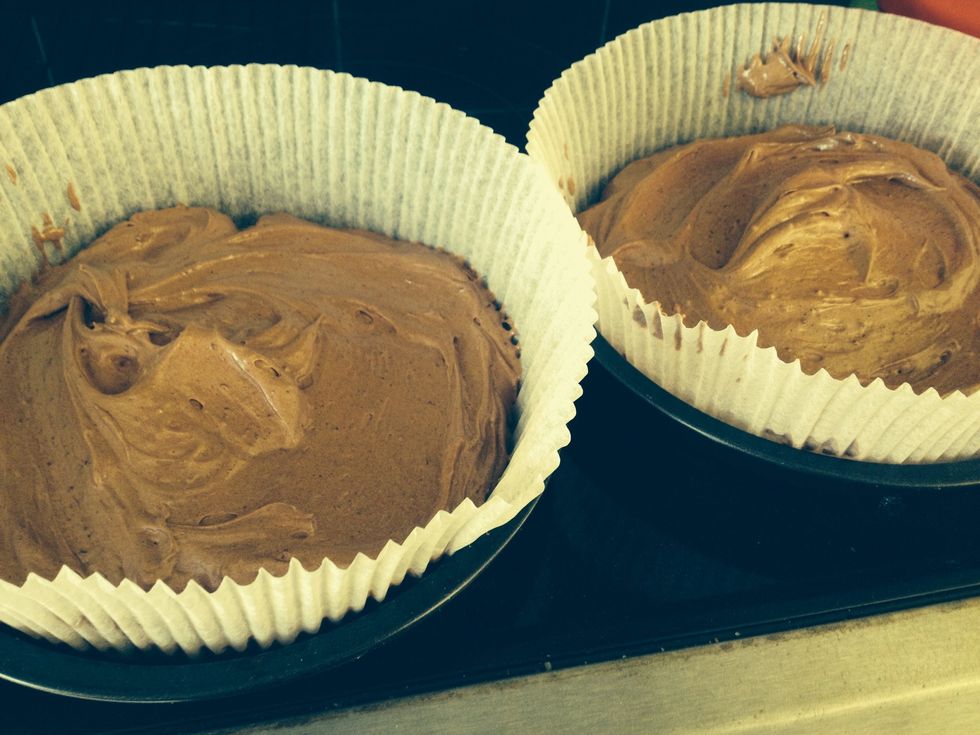 Put cake batter into two tins and place in the oven for 30 mins (or until spring and inserted knife comes out clean)