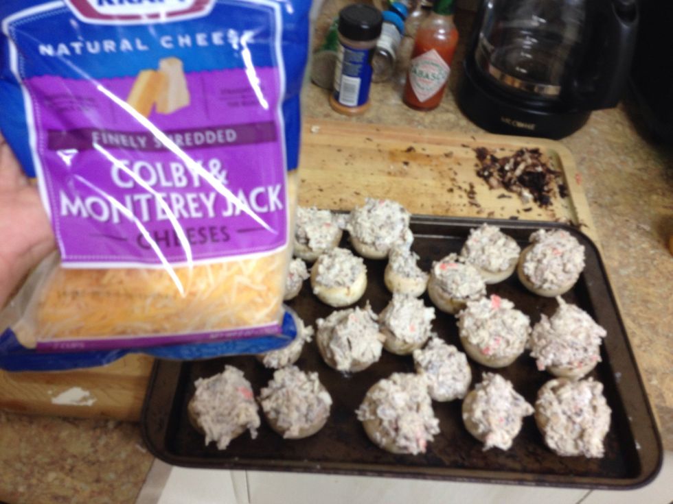 Put caps on baking tray and top with Colby cheese.