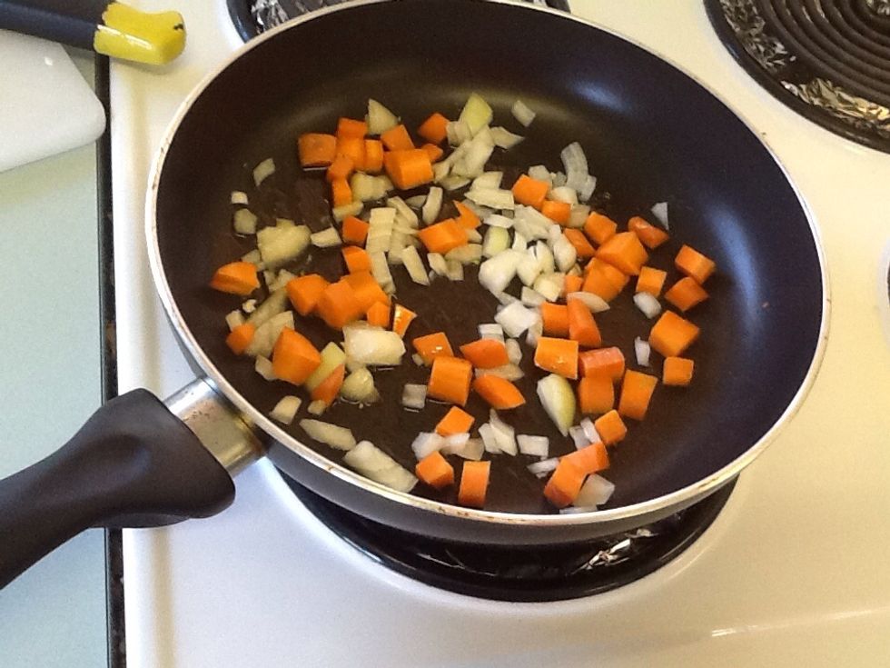 Put carrots and onion in the frying pan for 2 minutes