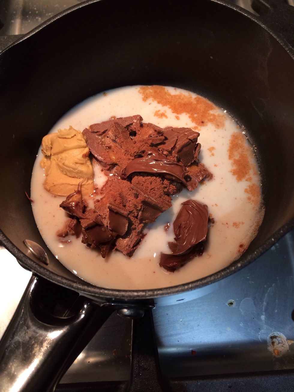 Put chopped chocolate bars, peanut butter, milk and milo in a small saucepan on a low heat.