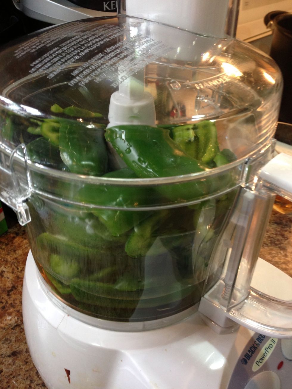 Put cleaned peppers into food processor with 1/2 of the vinegar last chance to check for seeds... Nobody wants a crunchy jelly.