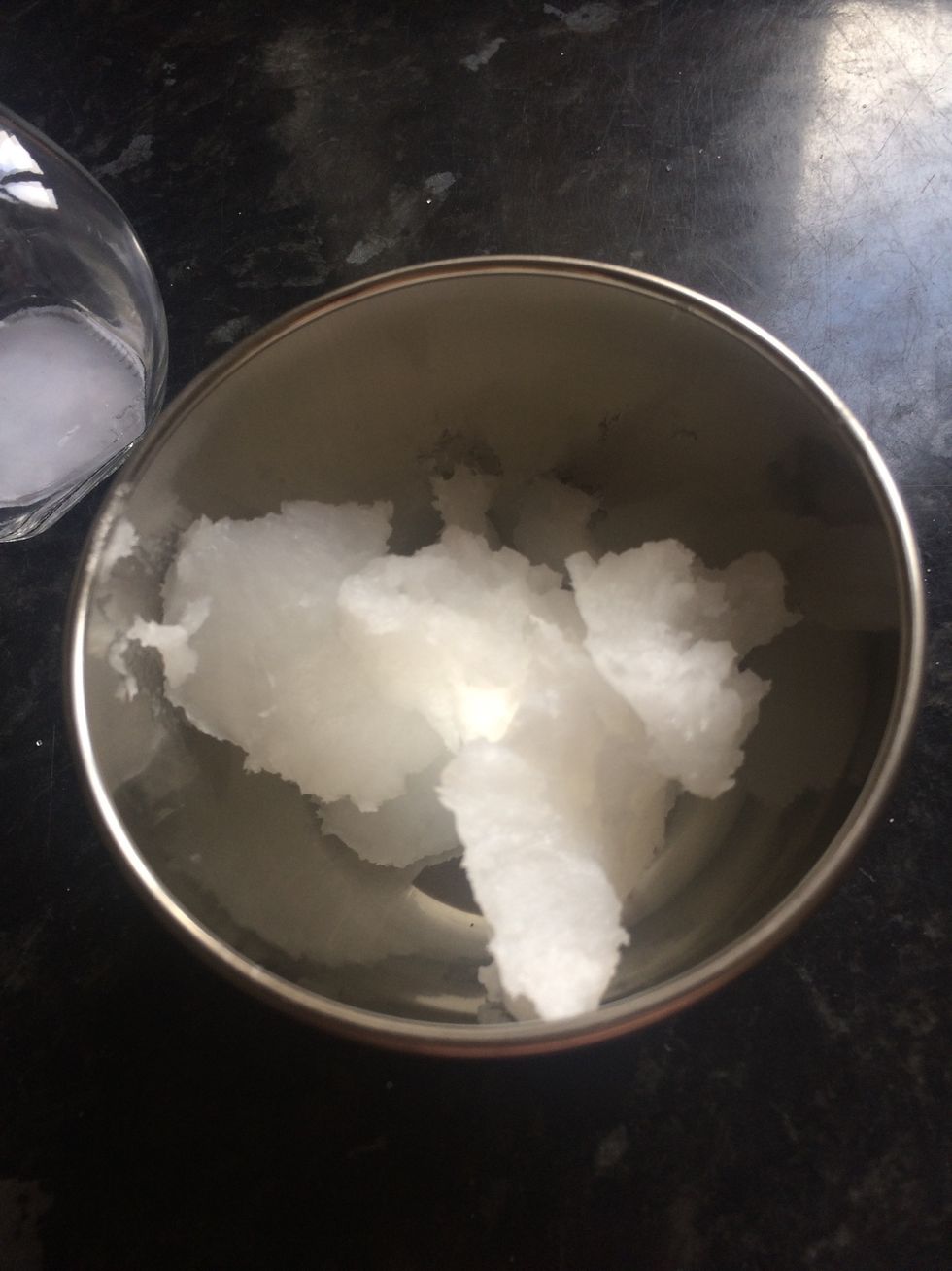 Put coconut oil in a bowl (depends on the size of the pot)