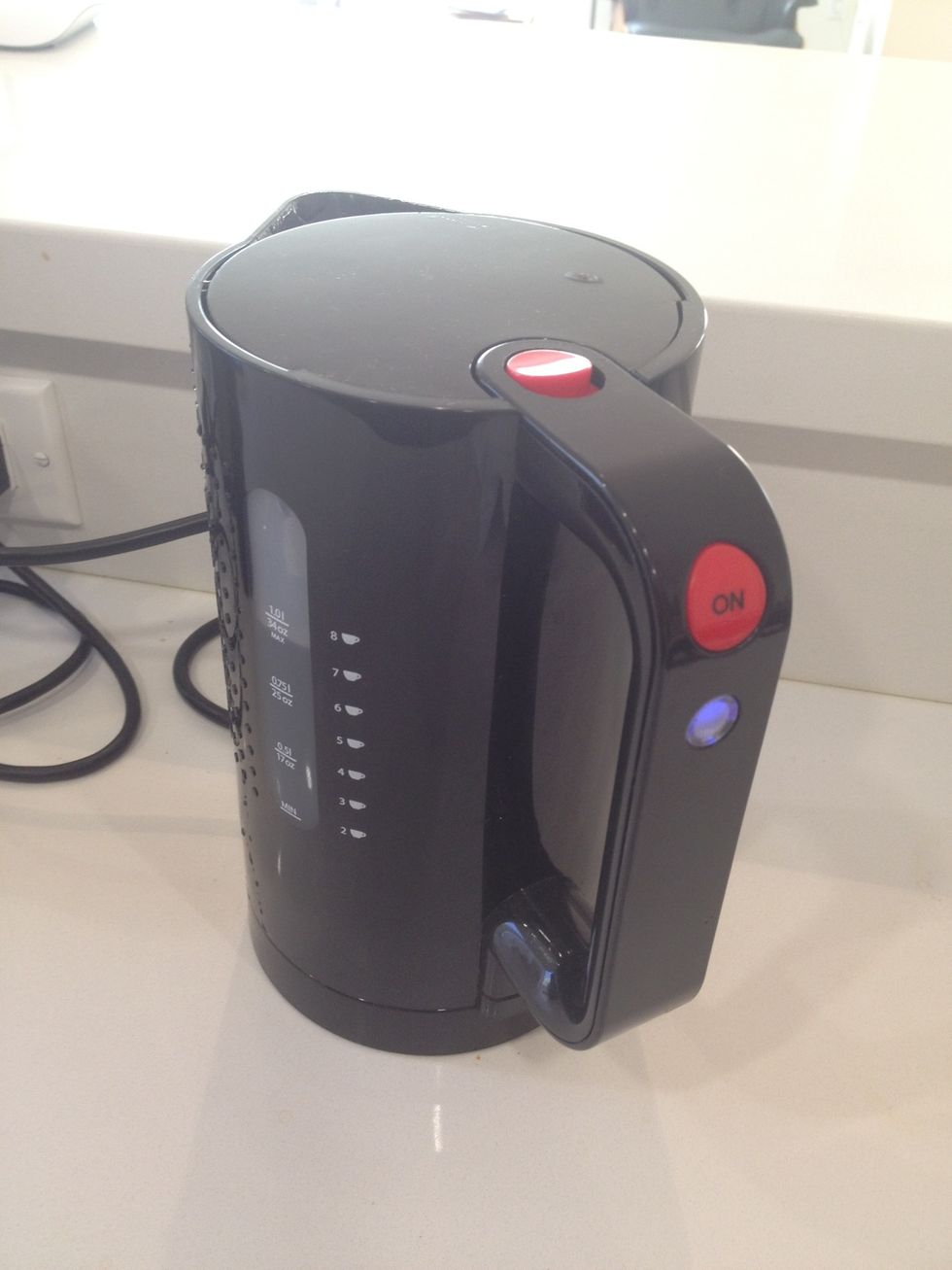Put cold water in a kettle and get it boiling. (Dont use hot tap water - it sometimes tastes funny from sitting in the hot water heater so long.)