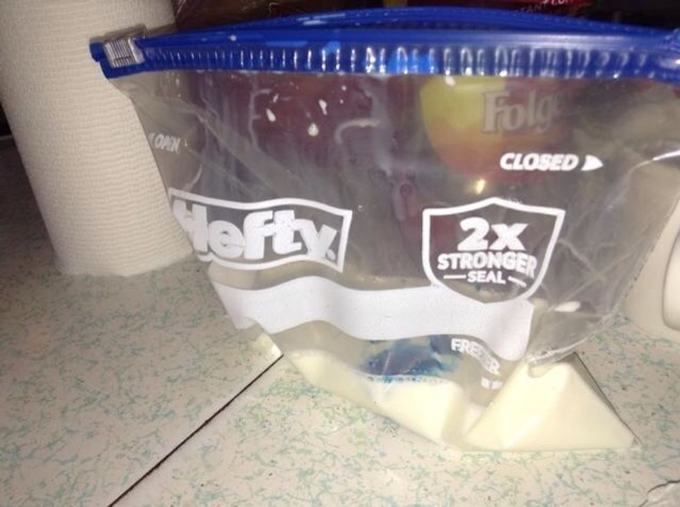 Put color dye (optional) into bag . Otherwise just pour the milk in there alone .