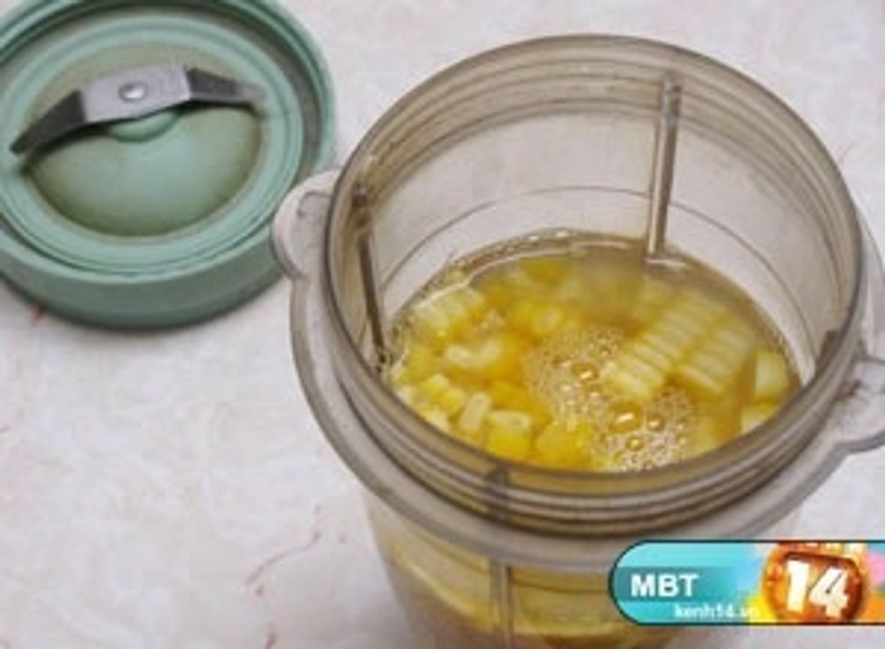 Put corn and water in grinder