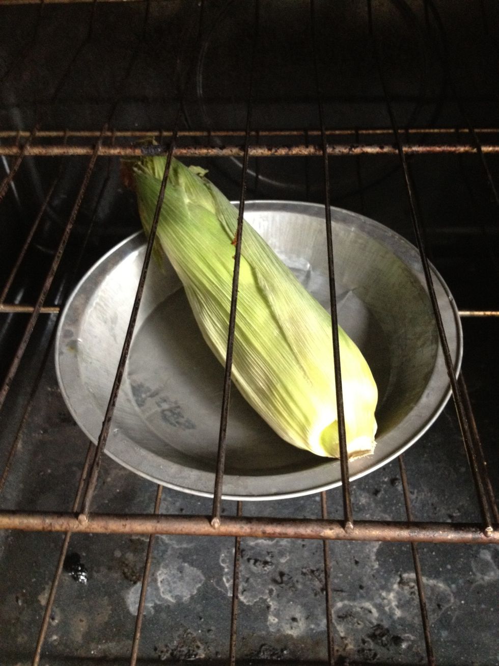 Put corn in the oven (375 degrees F.) for 20-30 minutes. You can use more ears if you want a bigger batch or use frozen corn ( just put in the oven until done).