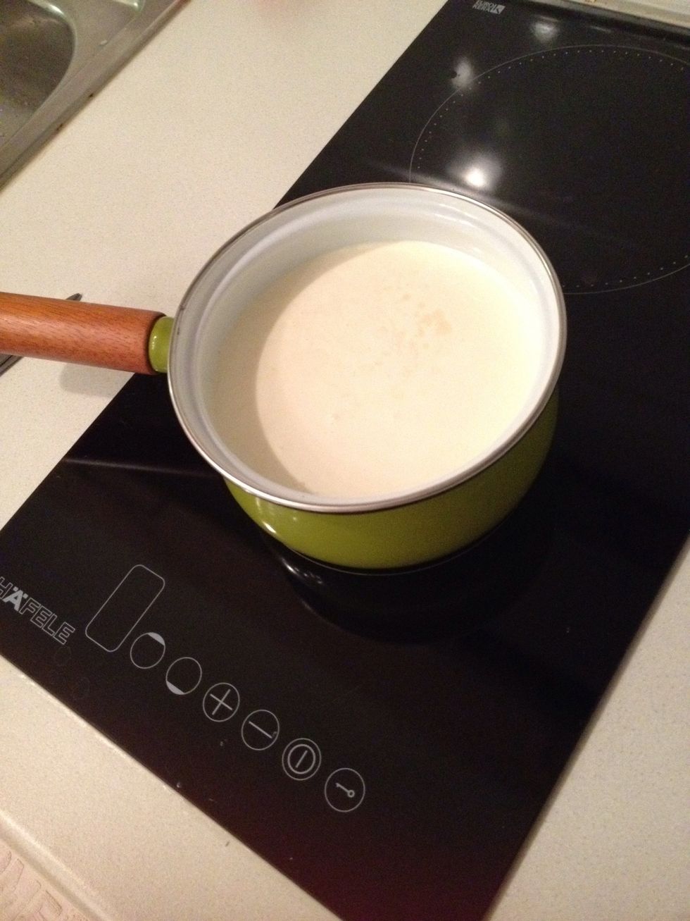 Put cream and milk in a pot leave it in room temp for a while.