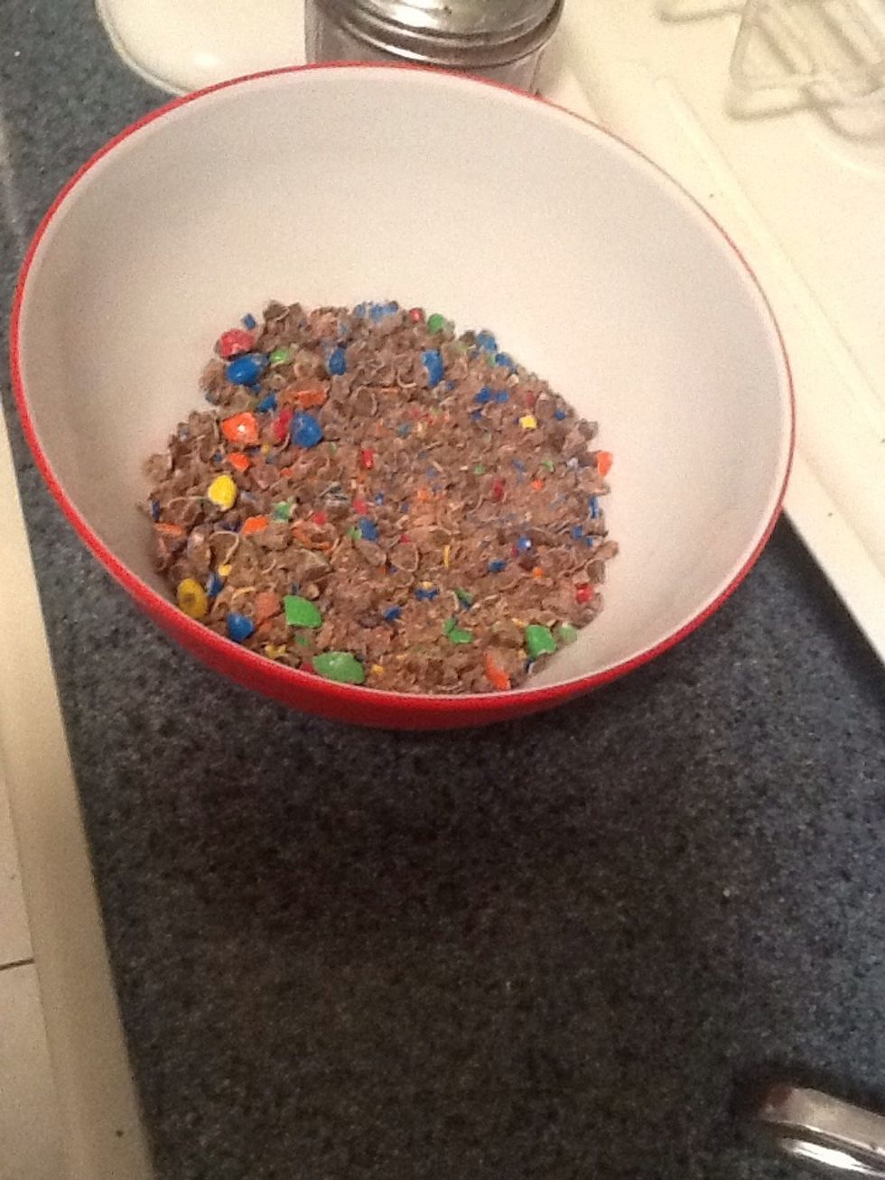 Put crushed m&ms in a bowl