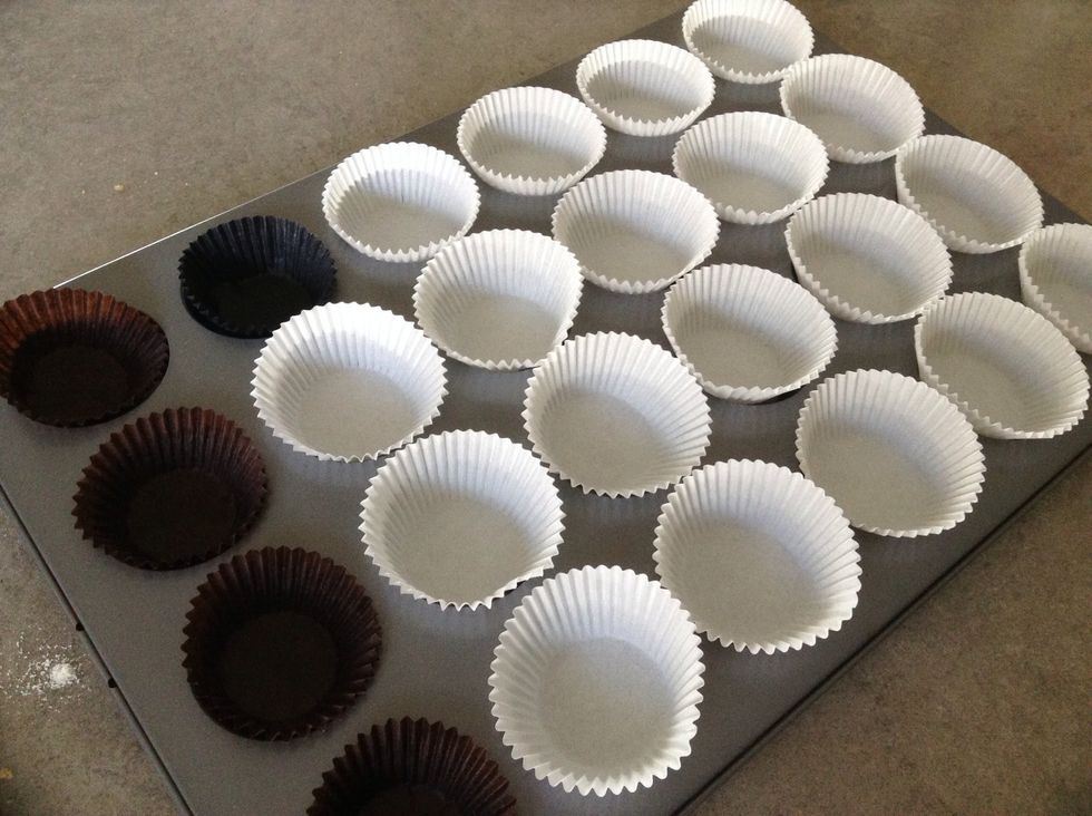Put cupcake cases into a cupcake pan