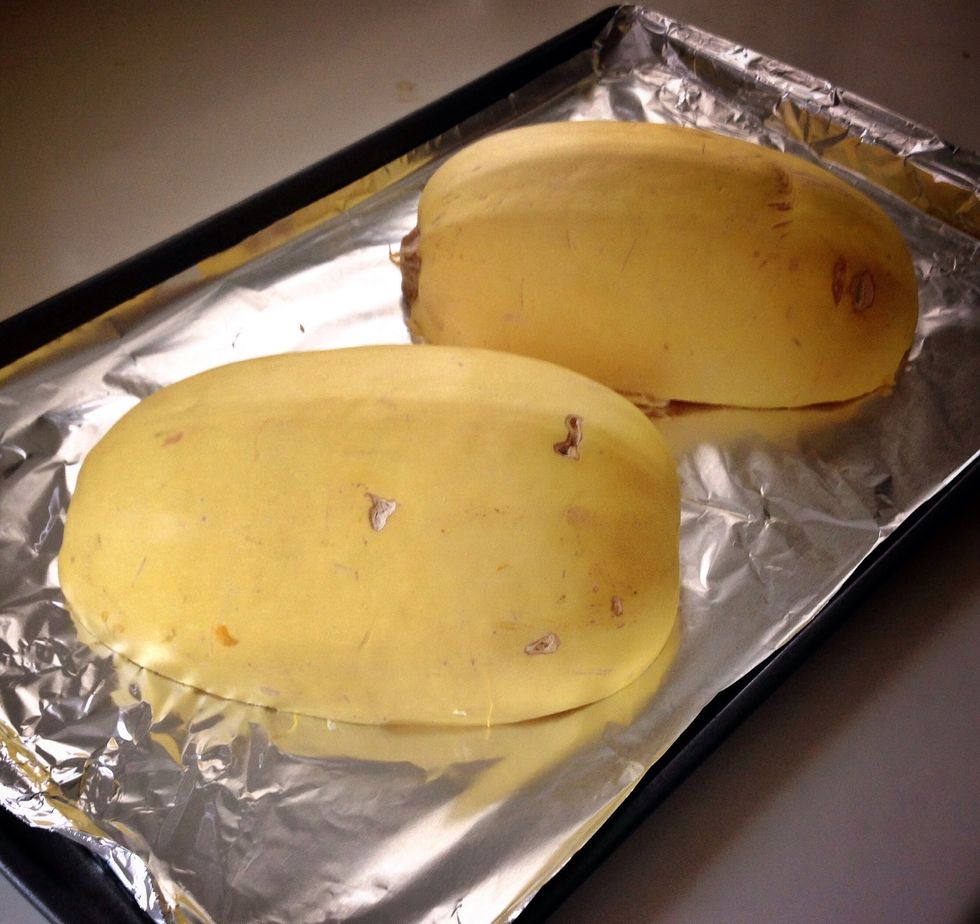 Put cut side down on a baking sheet. Bake at 350 degrees for about 30 minutes or until the outside is soft.