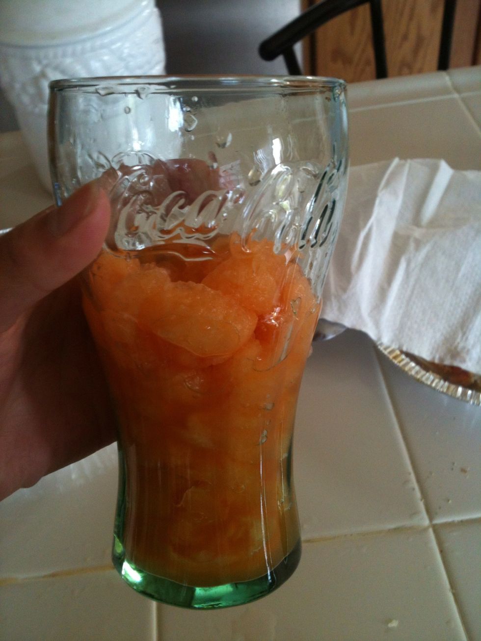 Put desired amount of cantaloupe in a cup. (I take a spoon and swipe it down the cantaloupe to create somewhat strips of cantaloupe)