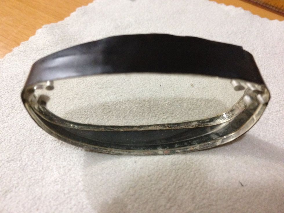 Put double sided tape around the edge of the lens. WIPE THE LENSES!! Then stick the two lens together in () direction by wrapping a black, firm plastic film.