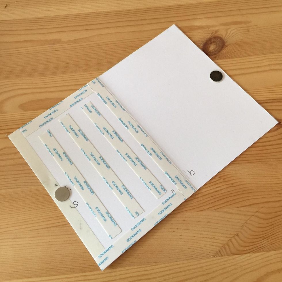 Put double-sided tape (on both parts) and glue two magnets.