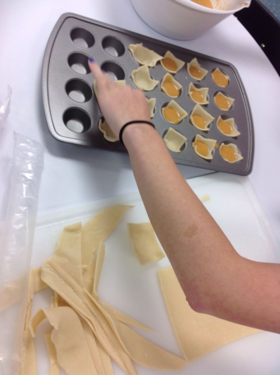 Put dough and pumpkin pie mix in a mini cupcake pan