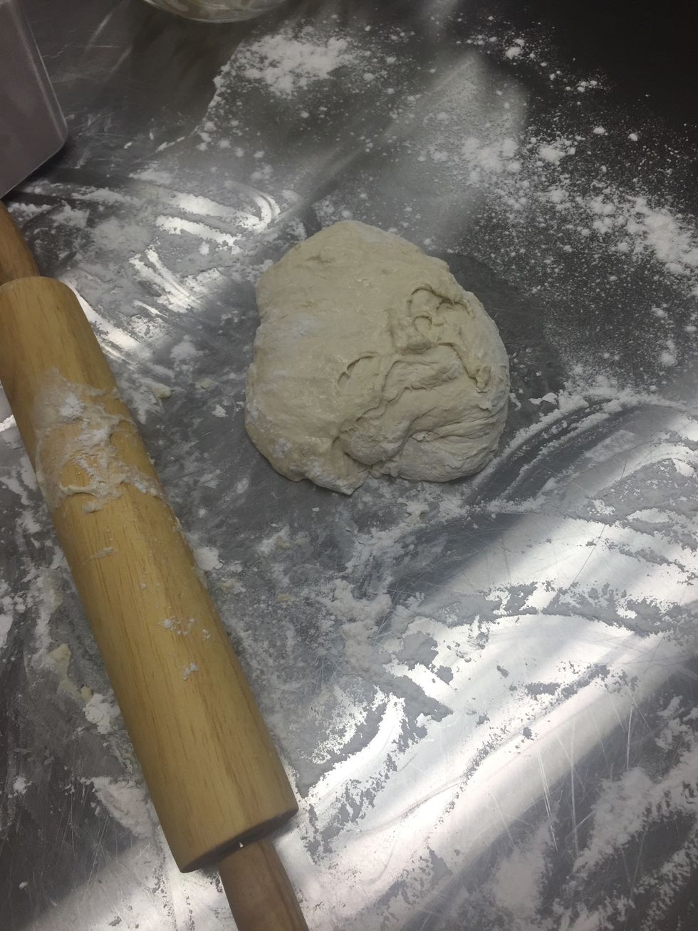 put dough on floured surface and roll into a ball